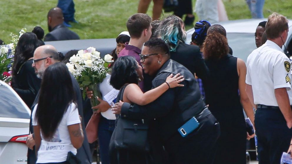 PHOTO: Mourners gather and embrace as they leave the funeral for Antwon Rose Jr., June 25, 2018, in Swissvale, Pa.