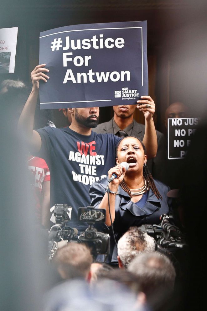 PHOTO: Protesters listen to one of the speakers as they rally in front of the Allegheny County Courthouse, June 21, 2018, in Pittsburgh for the killing of Antwon Rose Jr. who was fatally shot by a police officer.