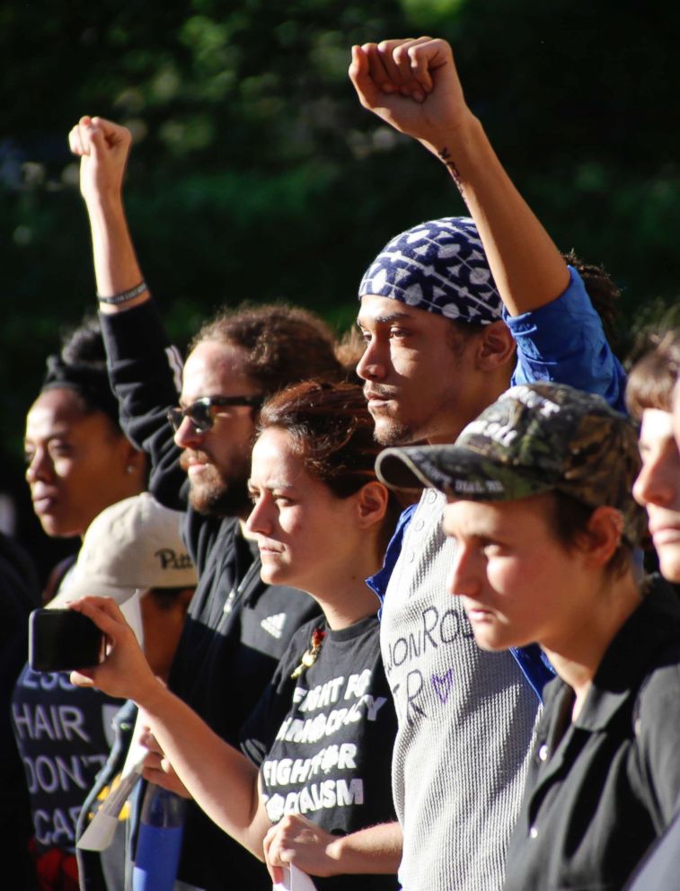 PHOTO: Marchers raise their fists as they protest the shooting death of Antwon Rose Jr. on Tuesday, June 26, 2018, in Pittsburgh.