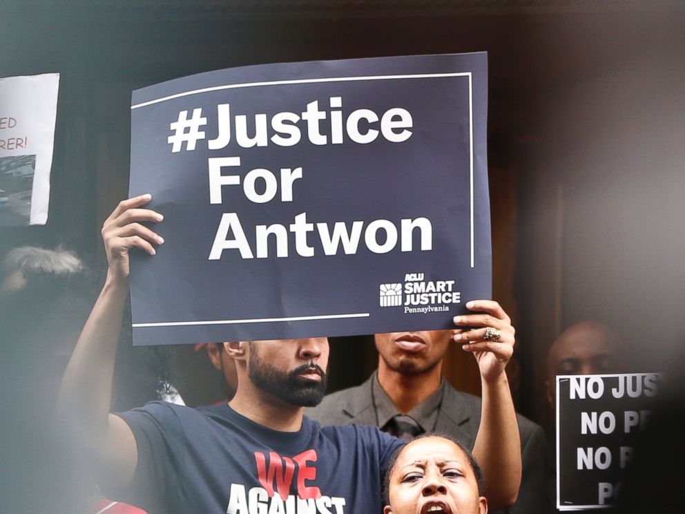 Protesters listen to one of the speakers as they rally in front of the Allegheny County Courthouse on Thursday, June 21, 2018, in Pittsburgh. Antwon Rose Jr. was fatally shot by a police officer seconds after he fled a traffic stop late Tuesday.