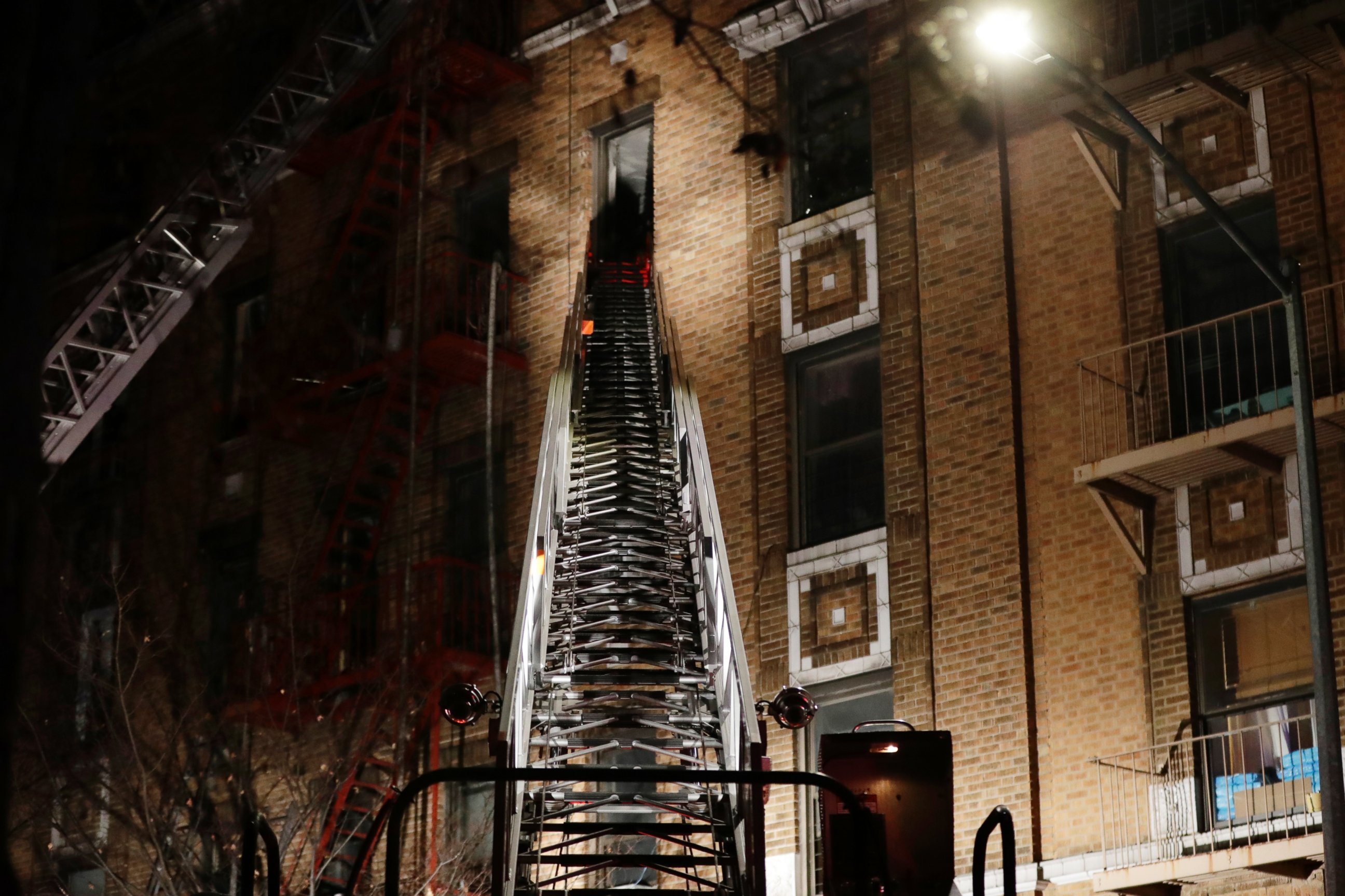 Firefighters respond to a deadly fire Thursday, Dec. 28, 2017, in the Bronx borough of New York.