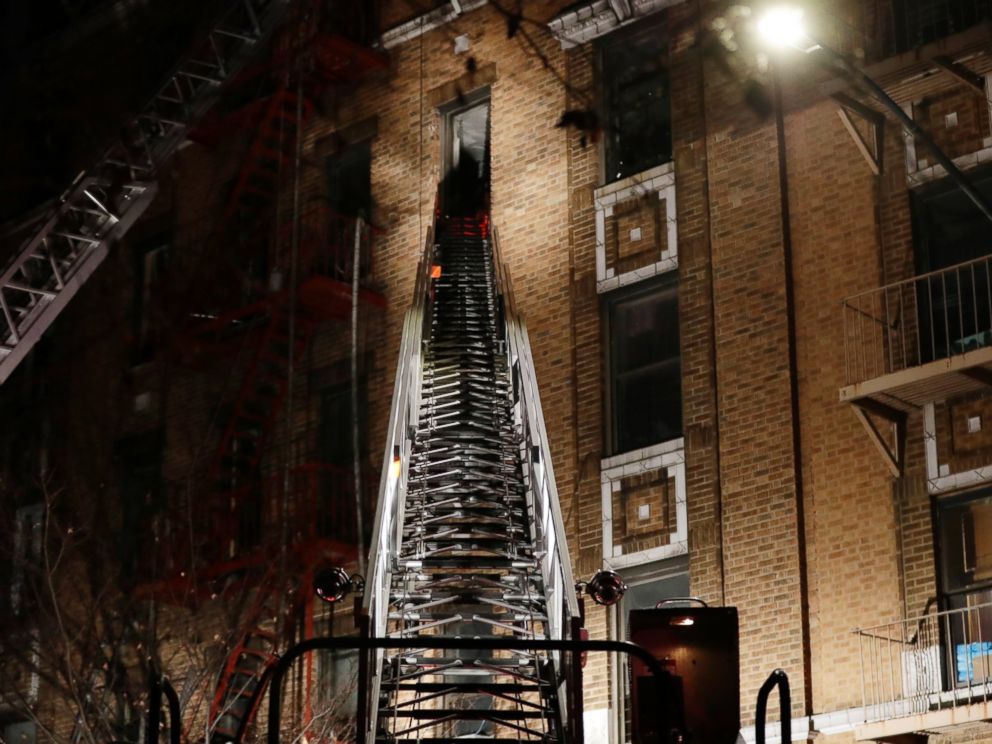 Firefighters respond to a deadly fire Thursday, Dec. 28, 2017, in the Bronx borough of New York.