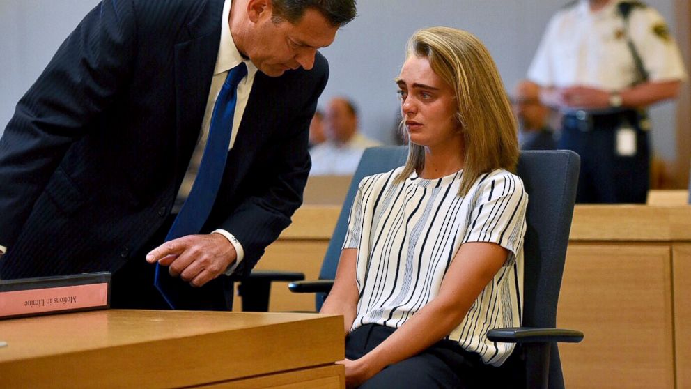 Attorney Joseph Cataldo talks to his client, Michelle Carter, before meeting at a side bar at the beginning of the court session at Taunton Juvenile Court in Taunton, Mass., June 5, 2017. Carter is charged with manslaughter for sending her boyfriend text messages encouraging him to kill himself.