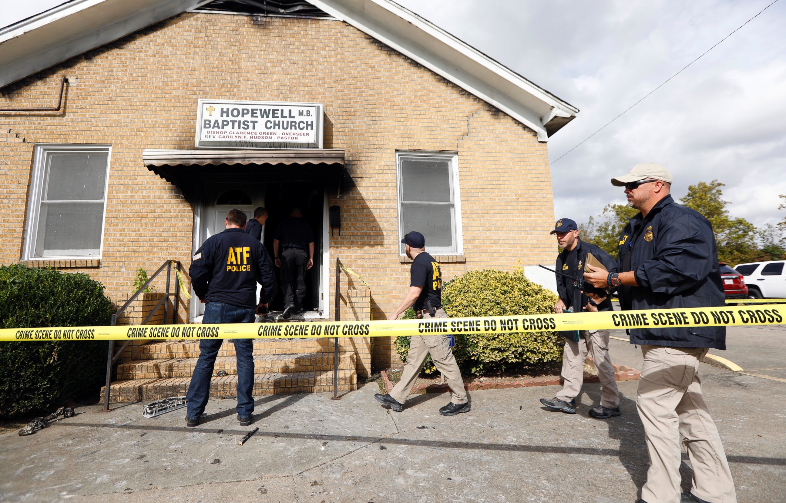 PHOTO: ATF agents gather outside the fire damaged Hopewell M.B. Baptist Church in Greenville, Mississippi, Nov. 2, 2016. "Vote Trump" was spray-painted on an outside wall of the black member church.