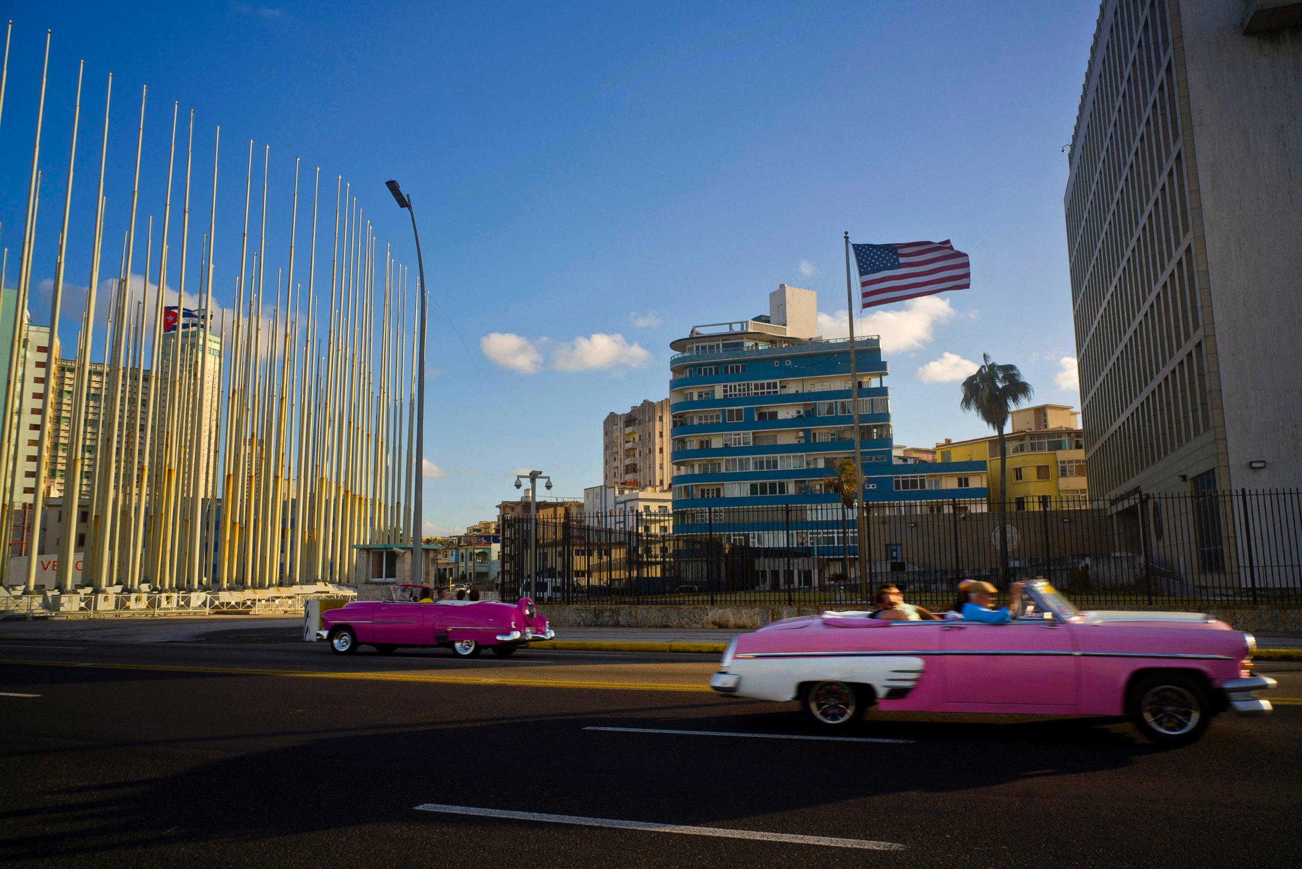 PHOTO: Tourists ride in classic American convertible cars past the United States embassy in Havana, Cuba, Jan. 12, 2017.  