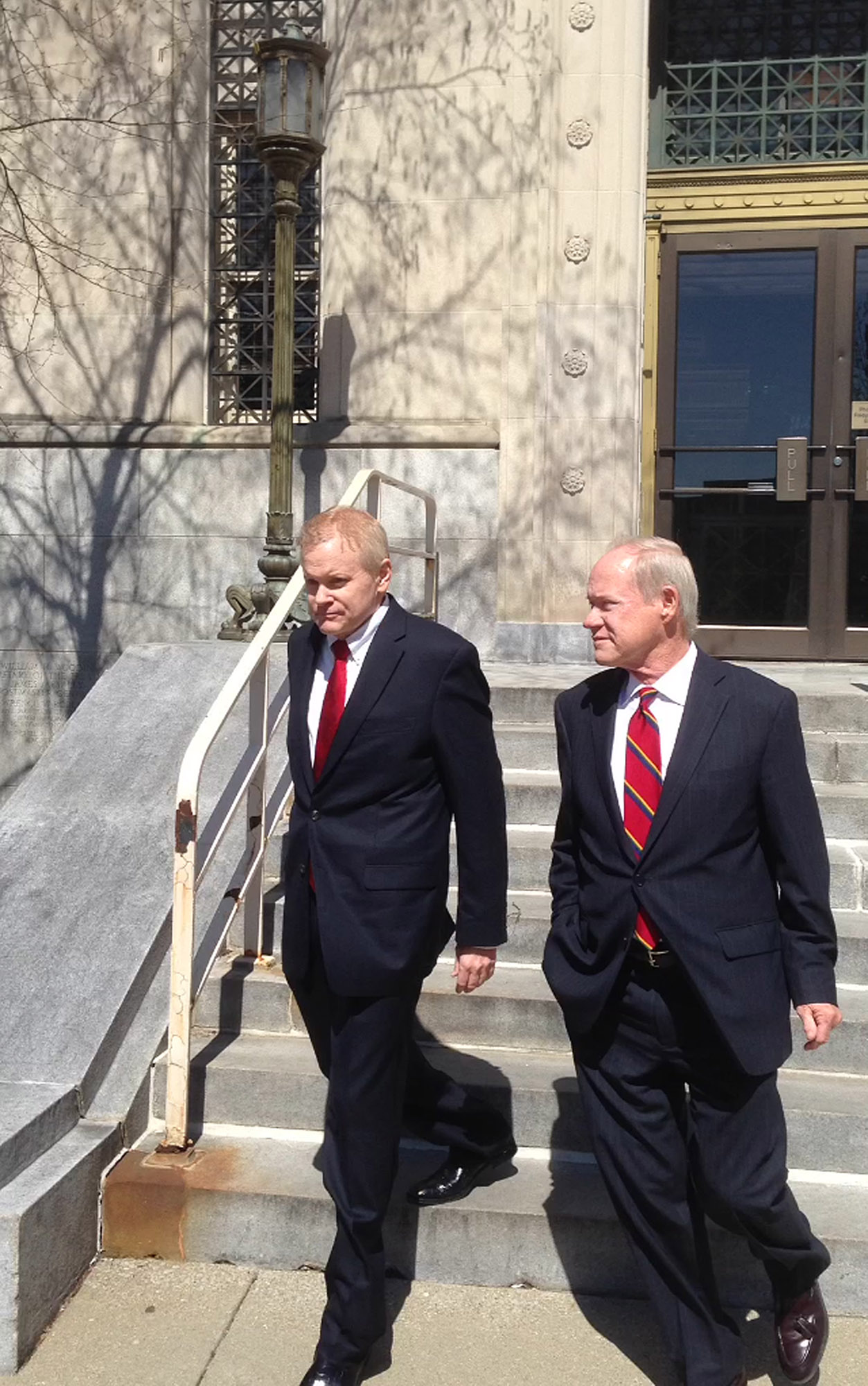 PHOTO: Eric C. Conn, left, walks out of a federal courthouse with defense attorney Joe Lambert on Tuesday, April 12, 2016, in Lexington, Ky., after being released on bond.