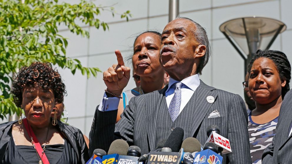 The Rev. Al Sharpton, second from right, gestures as he speaks to the media alongside members of Eric Garner's family, including Erica Garner, far right, after meeting with Department of Justice officials, Wednesday, June 21, 2017, in New York.