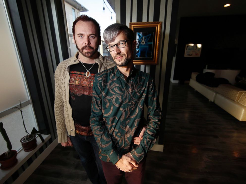 In this Tuesday, Nov. 28, 2017, photograph, Charlie Craig and David Mullins are shown in their home in Denver.