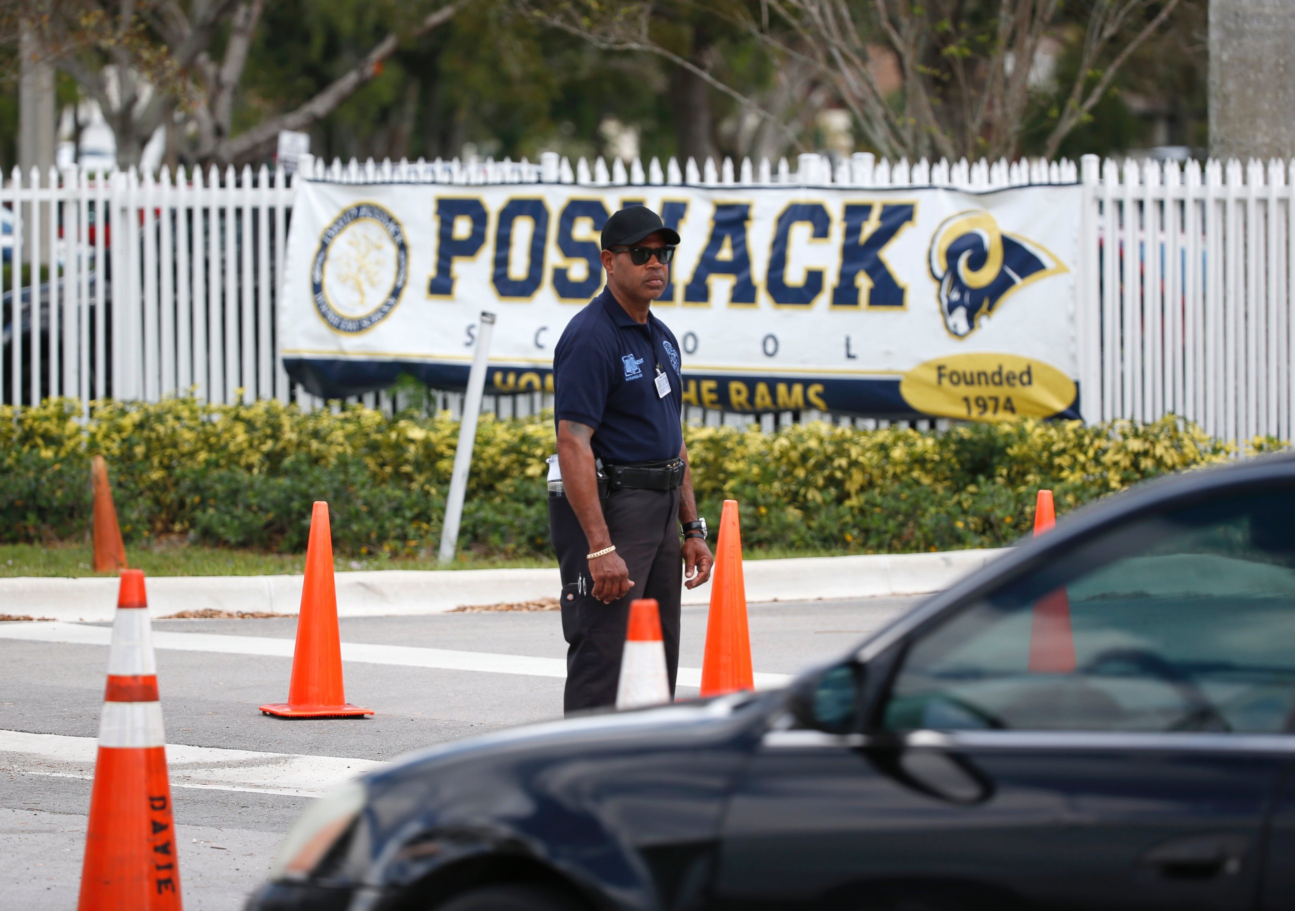 PHOTO: A security guard stands outside the entrance to the David Posnack Jewish Community Center and David Posnack Jewish Day School after people were evacuated because of a bomb threat, Feb. 27, 2017, in Davie, Fla.