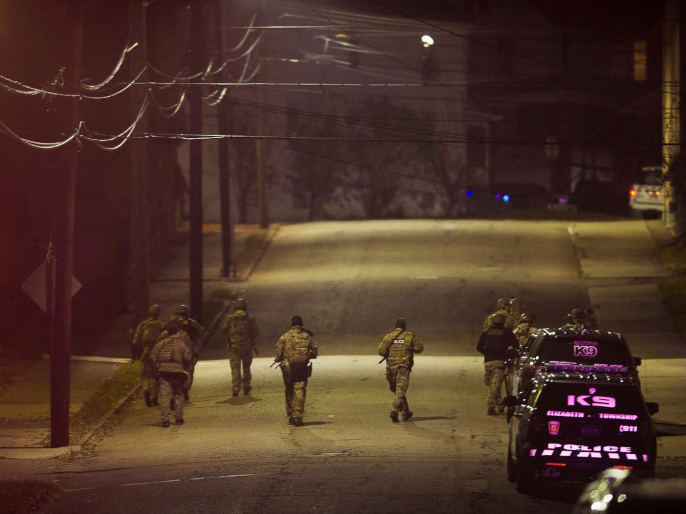PHOTO: A SWAT team walks along a street in the neighborhood where a police officer was fatally shot Friday, Nov. 17, 2017, in New Kensington, Pa.