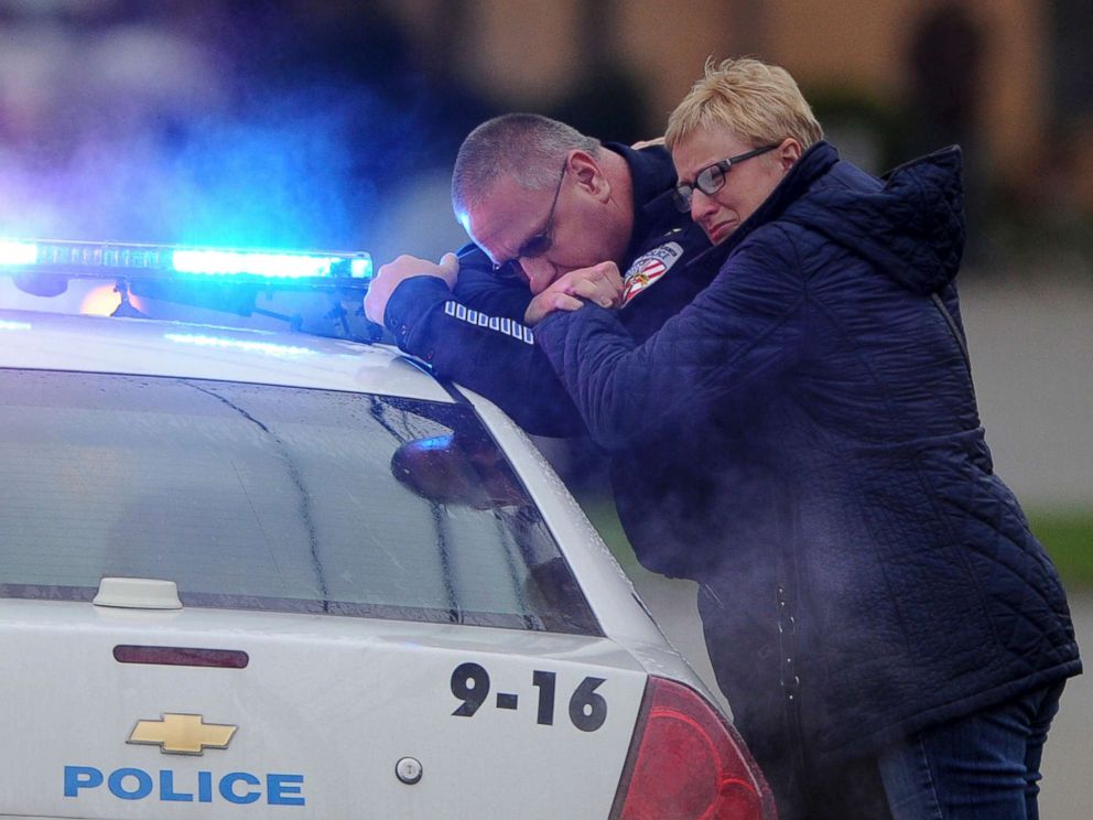 PHOTO: Kensington Police Chief James Klein and Lisa Shaw, mother of slain New Kensington Police Officer Brian Shaw share a moment while waiting at the Rusiewicz Funeral Home for the procession to arrive, Nov. 18, 2017, in New Kensington, Pa.