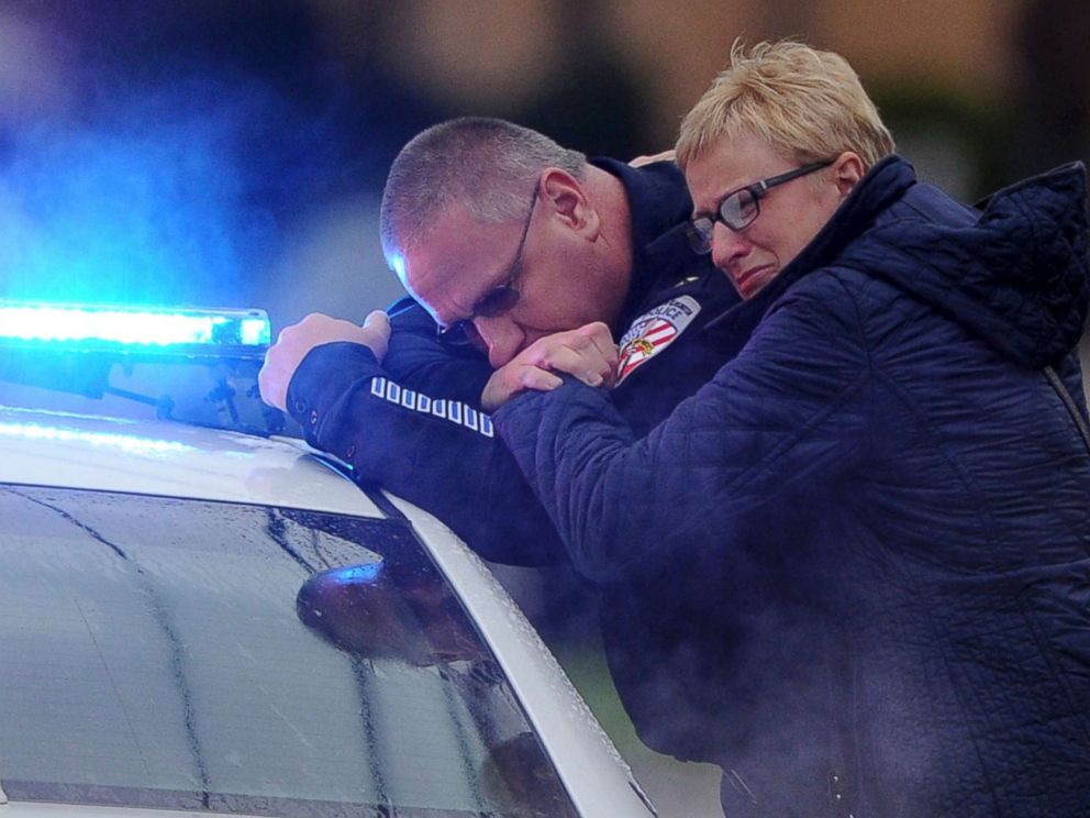 PHOTO:  Kensington Police Chief James Klein and Lisa Shaw, mother of slain New Kensington Police Officer Brian Shaw share a moment while waiting at the Rusiewicz Funeral Home for the procession to arrive, Nov. 18, 2017, in New Kensington, Pa.