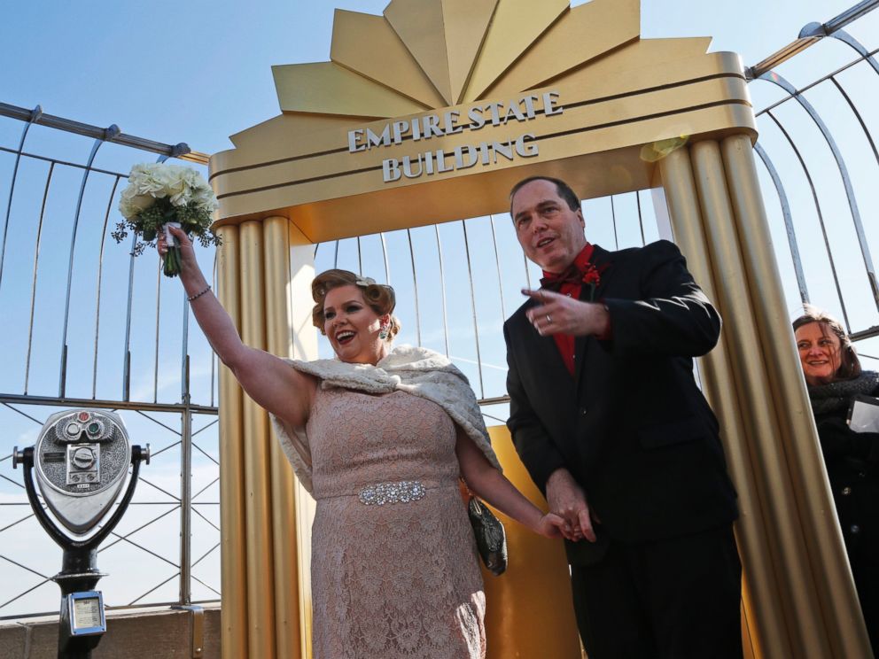 PHOTO: Catherine Fiehn LeStrange and Eric LeStrange, of Shelton, Conn., react after being married on the observation deck of the Empire State Building in New York, Feb. 14, 2017.