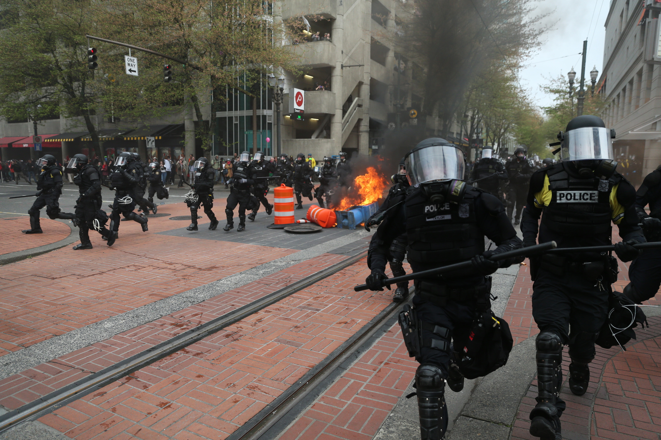 PHOTO: Police disperse people participating in a May Day rally in downtown Portland, Oregon, May 1, 2017. 