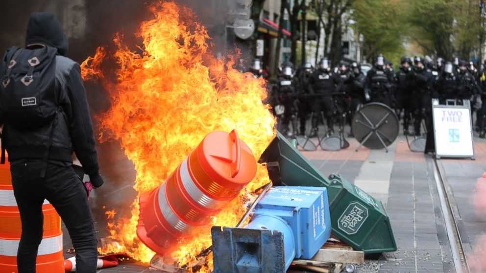 Police try to disperse people participating in a May Day rally in downtown Portland, Oregon, May 1, 2017. Police in Portland said the permit obtained for the May Day rally and march there was canceled as some marchers began throwing projectiles at officers.