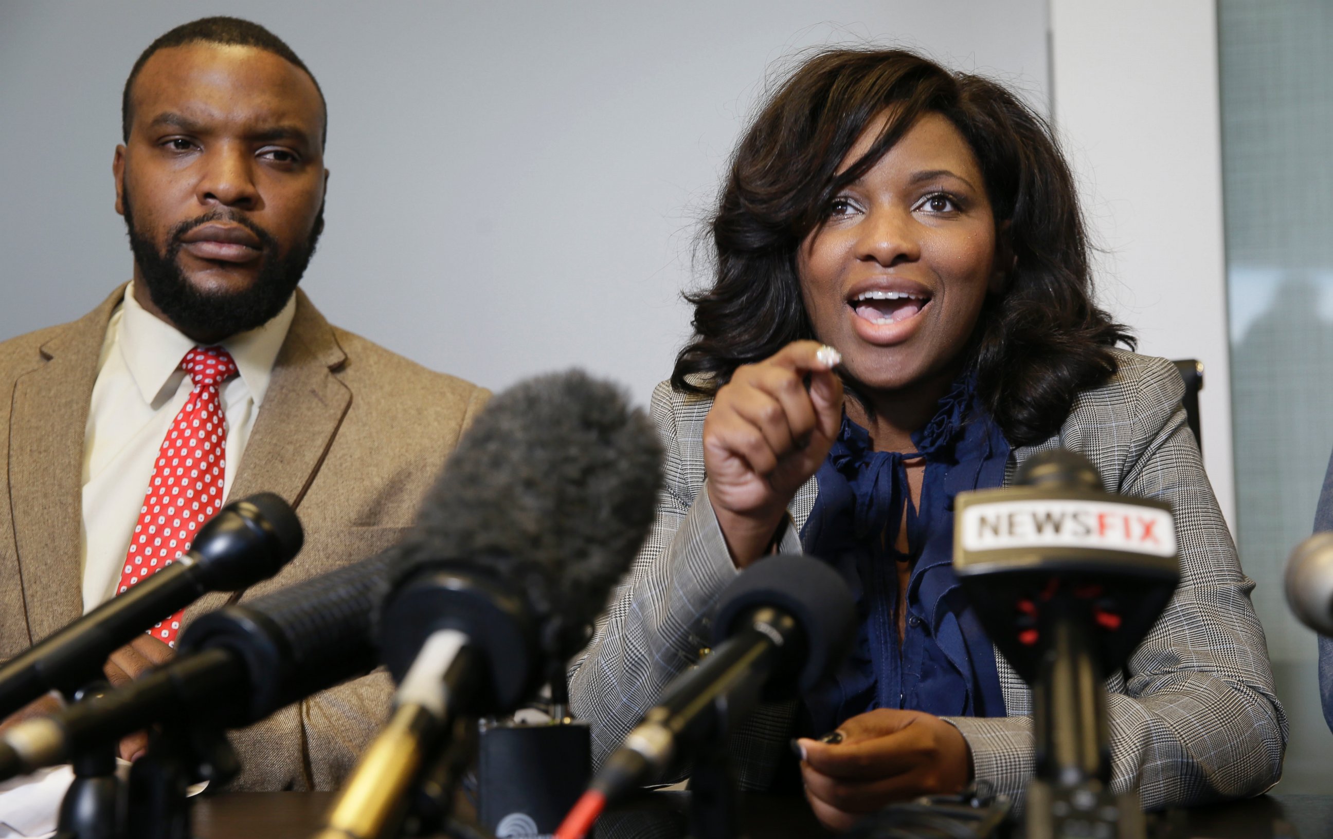 PHOTO: Attorney Jasmine Crockett, right, speaks while her law partner attorney Lee Merritt listens during a news conference in Dallas, Thursday, Jan. 26, 2017.