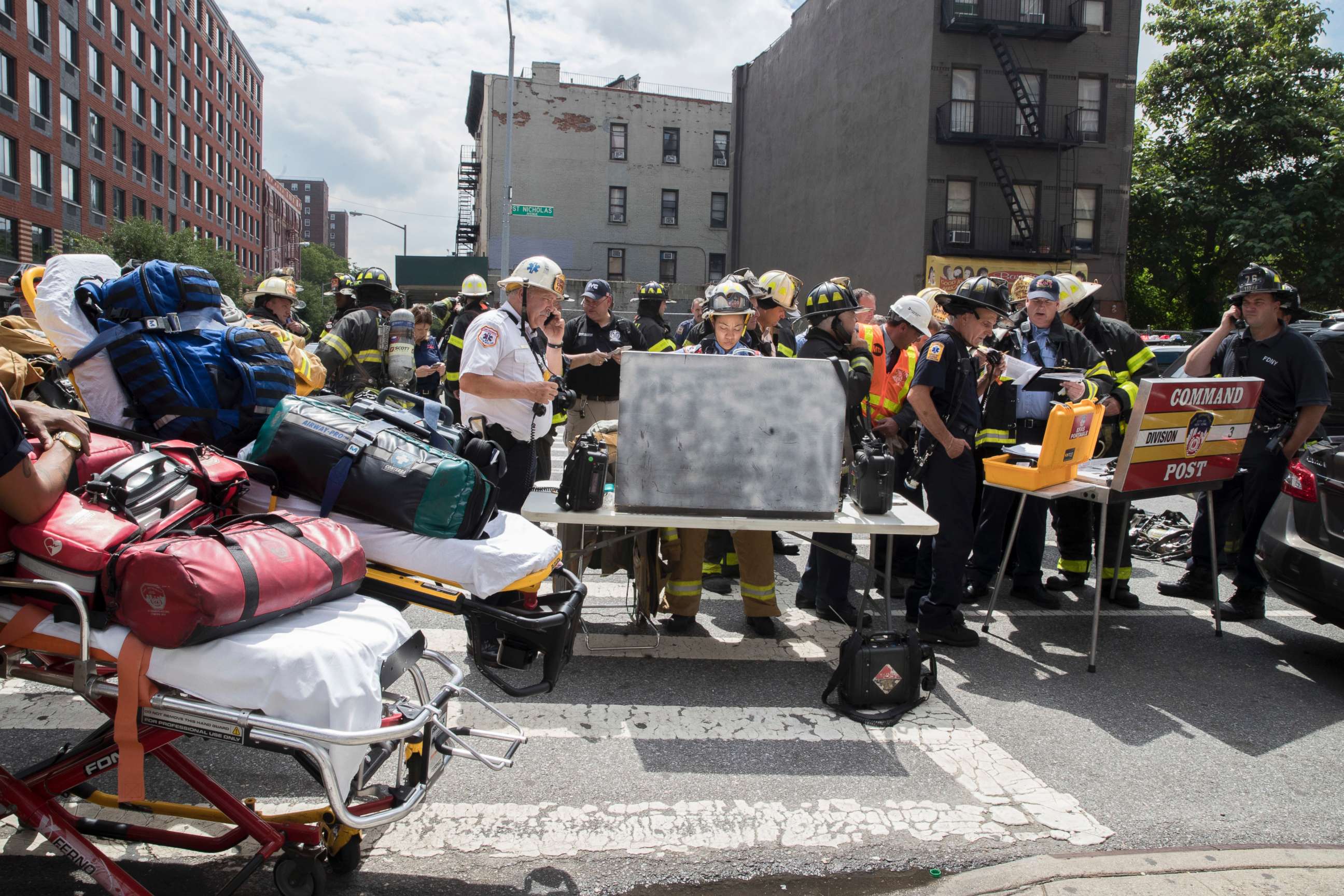 PHOTO: Emergency service personnel work at the scene of a subway derailment, Tuesday, June 27, 2017, in the Harlem neighborhood of New York.