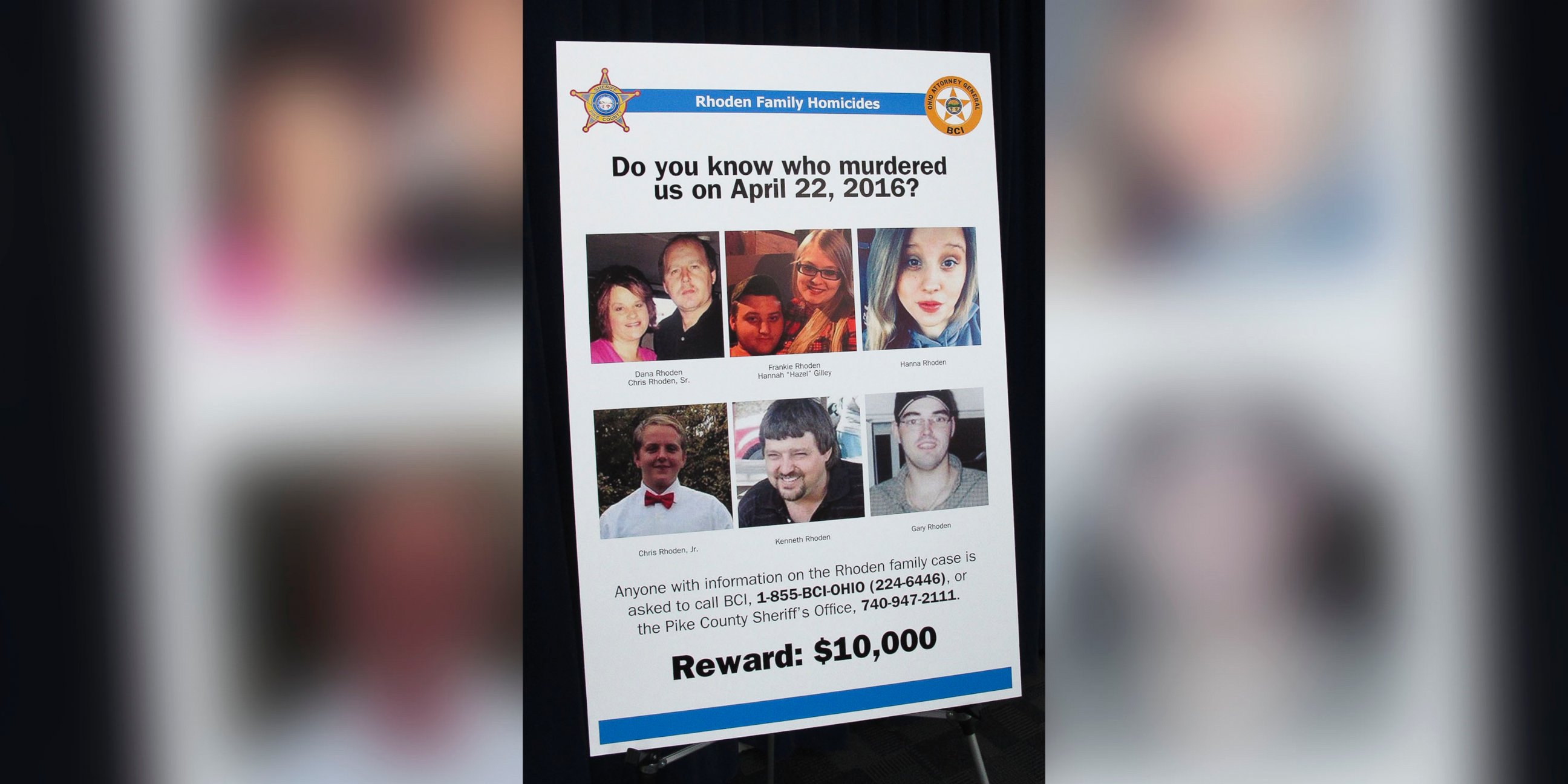 PHOTO: A poster asking for information about the 2016 unsolved killings of eight family members in southern Ohio, is displayed at the Ohio Attorney General's Office during a press conference, April 13, 2017, in Columbus Ohio.