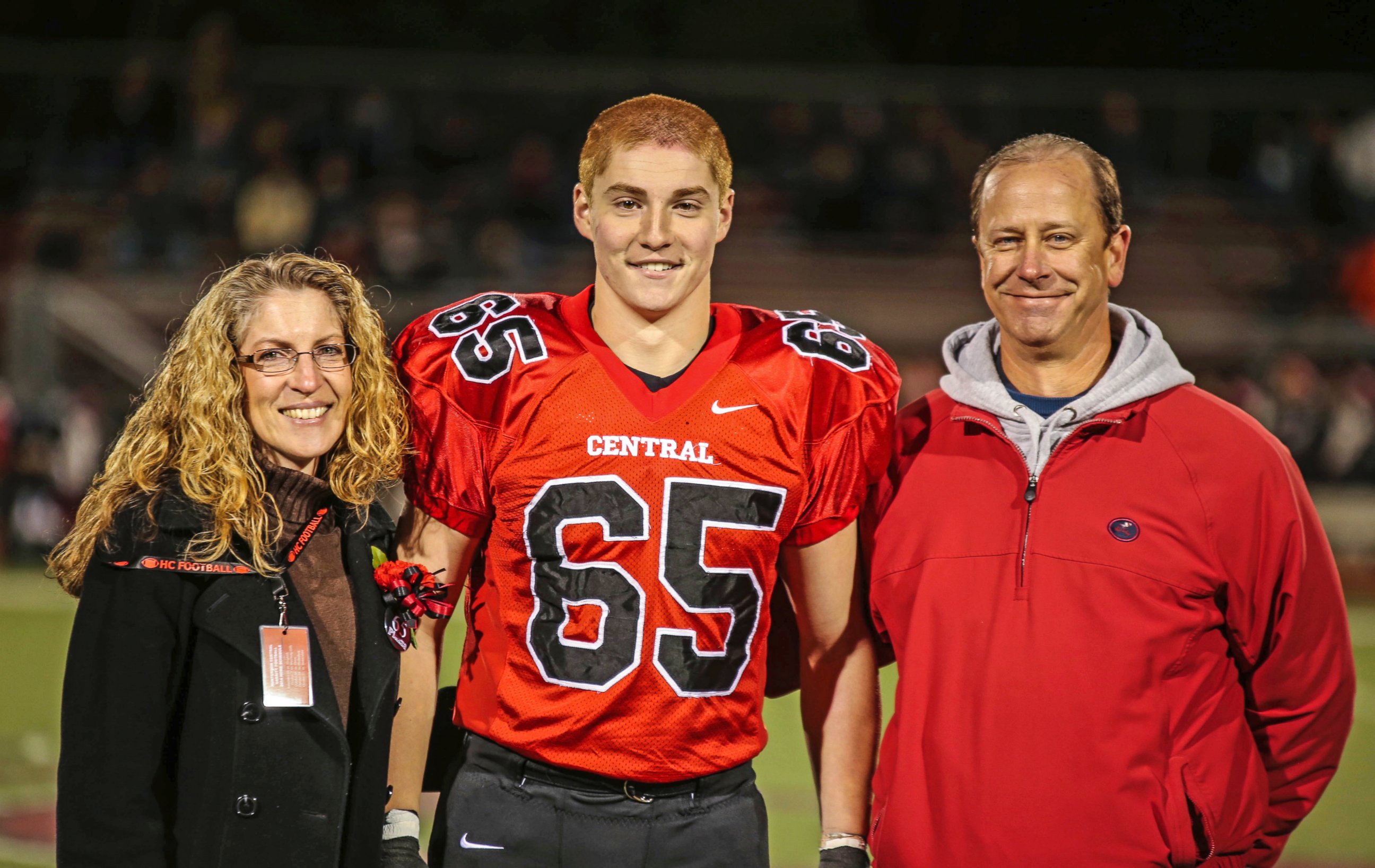 PHOTO: This Oct. 31, 2014 photo shows Timothy Piazza, center, with his parents Evelyn Piazza, left, and James Piazza, right, during Hunterdon Central Regional High School football's "Senior Night" at the high school's stadium in Flemington, N.J. 