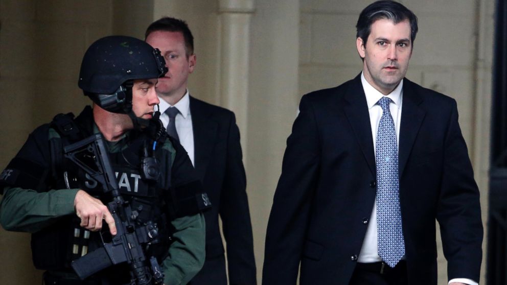 In this Monday, Dec. 5, 2016, file photo, former South Carolina police officer Michael Slager, right, walks from the Charleston County Courthouse under the protection of the Charleston County Sheriff's Department after a mistrial was declared for his trial in Charleston, S.C.