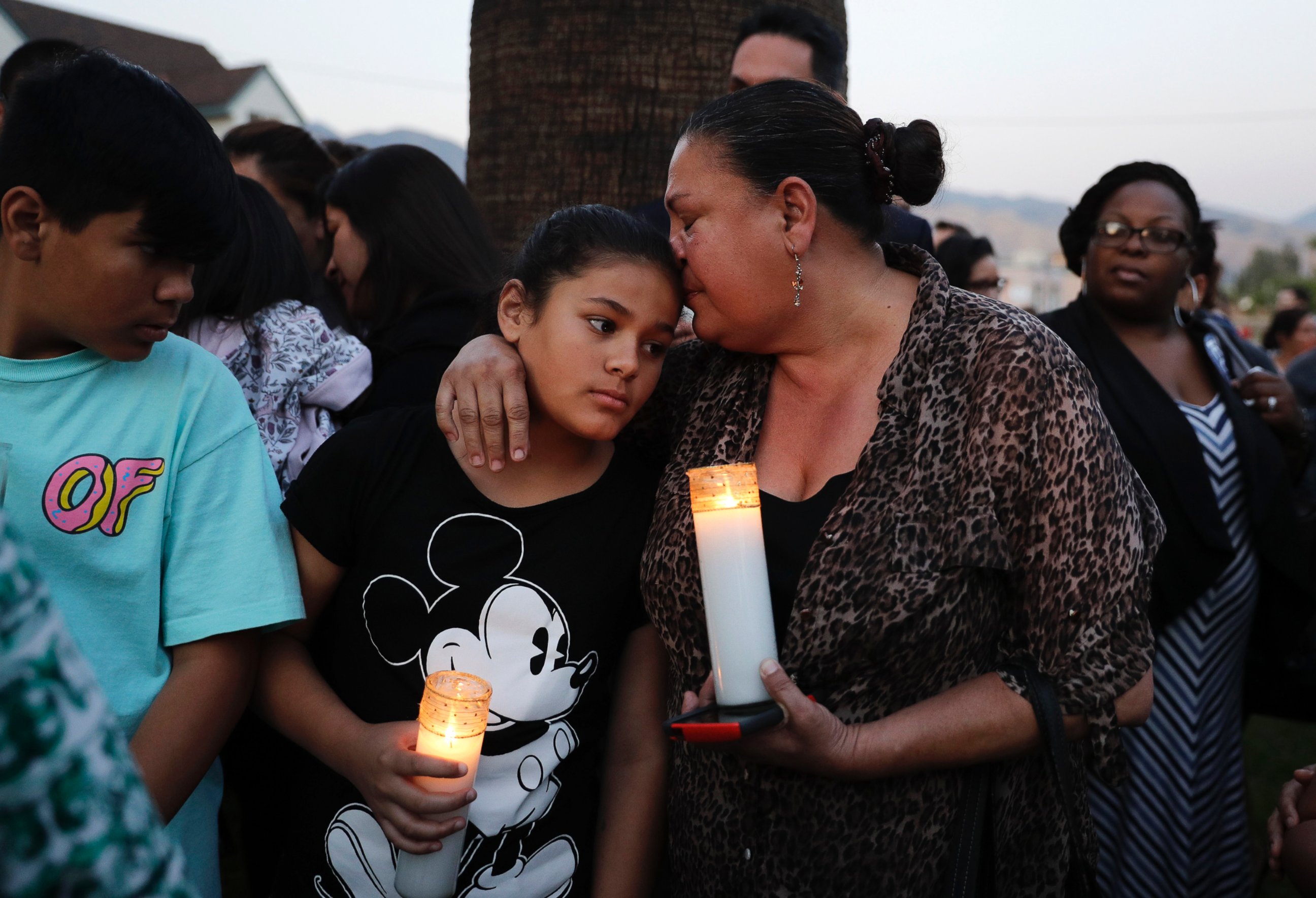 PHOTO: Betty Rodriguez, right, comforts her granddaughter Giselle during a prayer service held to honor the shooting victims at North Park Elementary School, April 10, 2017, in San Bernardino, Calif. 