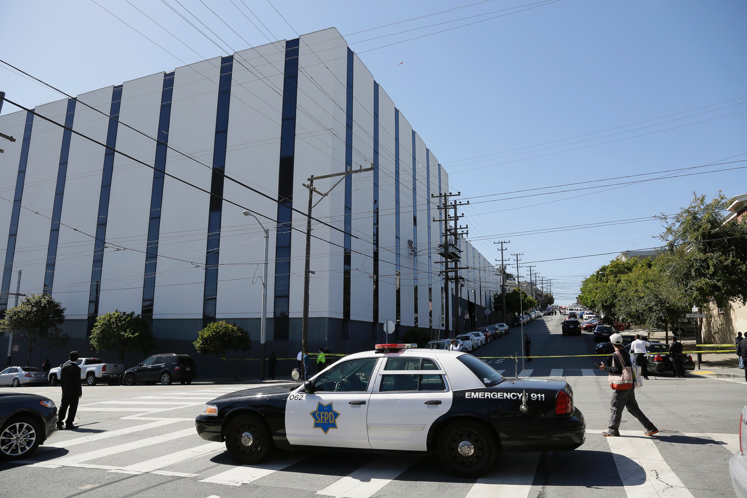 PHOTO: A San Francisco police car blocks a roadway outside a UPS package delivery warehouse where a shooting took place Wednesday, June 14, 2017, in San Francisco.