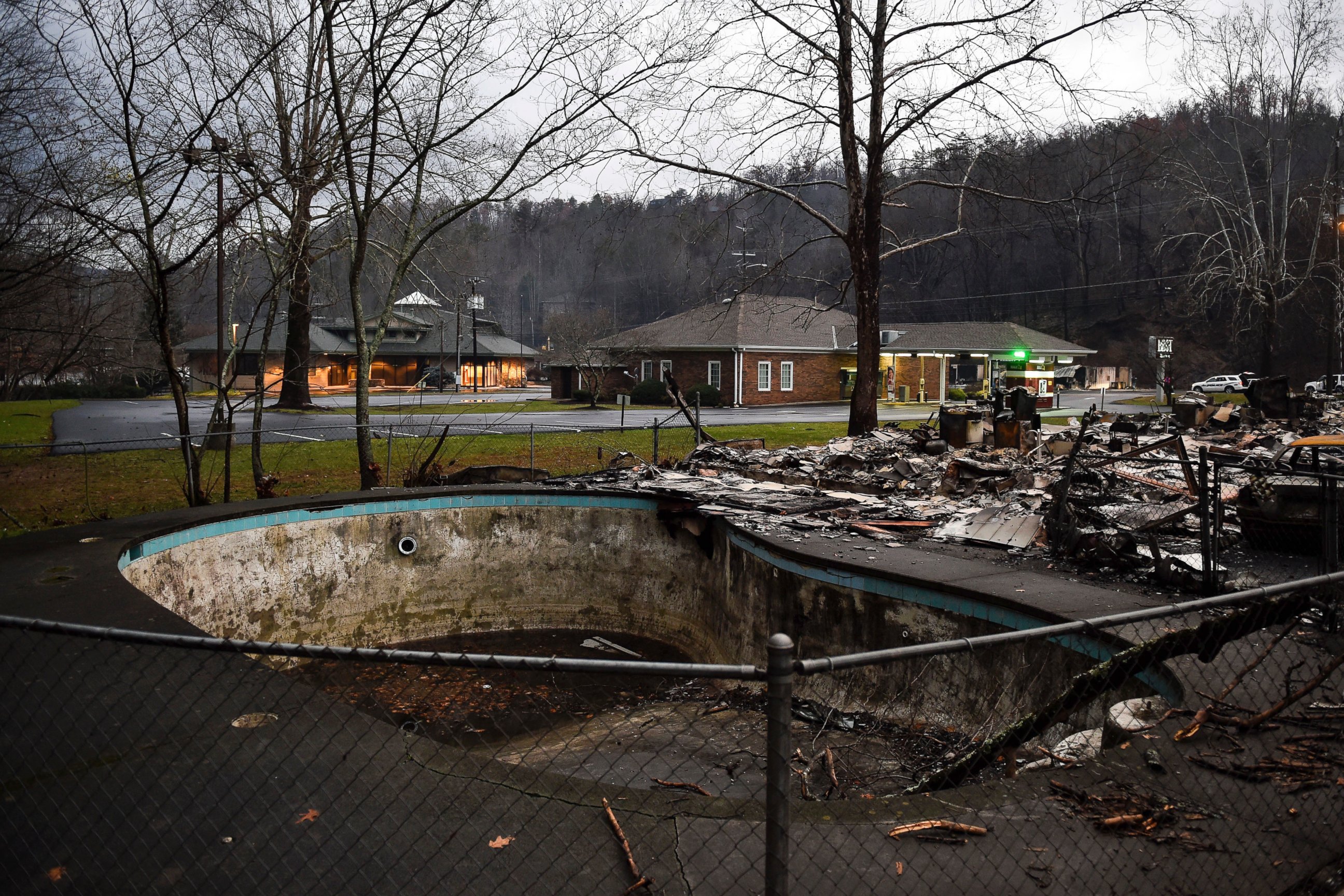 PHOTO: A damaged pool is among the remains of Creek Place Efficiencies after a wildfire in Gatlinburg, Tennessee, Nov. 30, 2016. 
