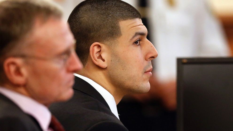 Former New England Patriots football player Aaron Hernandez, right, listens during his murder trial as defense attorney Charles Rankin, left, looks on, Jan. 29, 2015, in Fall River, Mass.