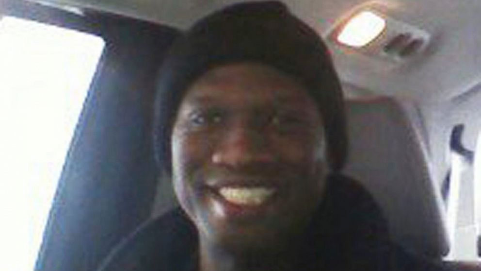 This undated cell phone photo provided by Kristi Kinard Suthamtewakul shows a smiling Aaron Alexis in Fort Worth, Texas.