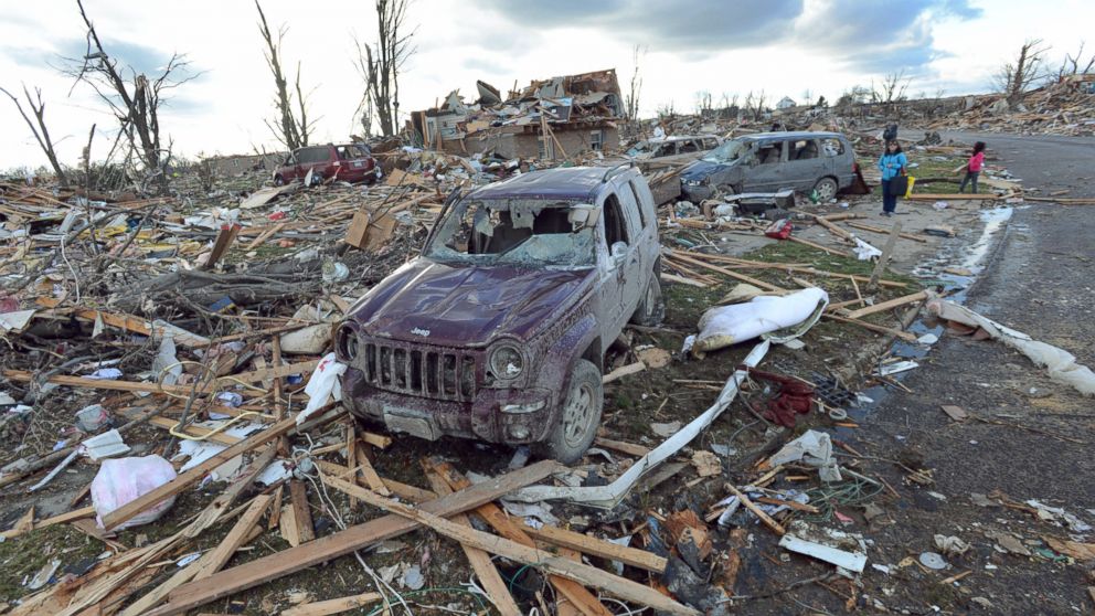 Demolished homes and vehicles in the Devonshire Subdivision in Washington, Ill., Sunday, Nov. 17, 2013. Intense thunderstorms and tornadoes swept across the Midwest, causing extensive damage in several central Illinois communities while sending people to their basements for shelter. 