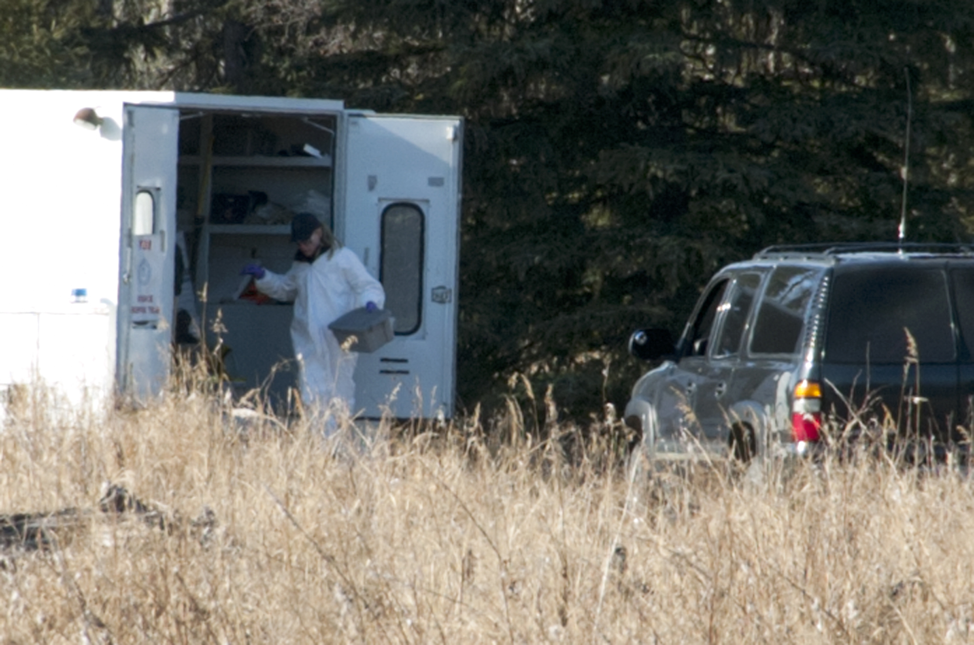 PHOTO: Investigators set up a temporary facility between Alpine Drive and Borgen Avenue, March 22, 2015, after finding human remains that could be a family from Kenai, Alaska.