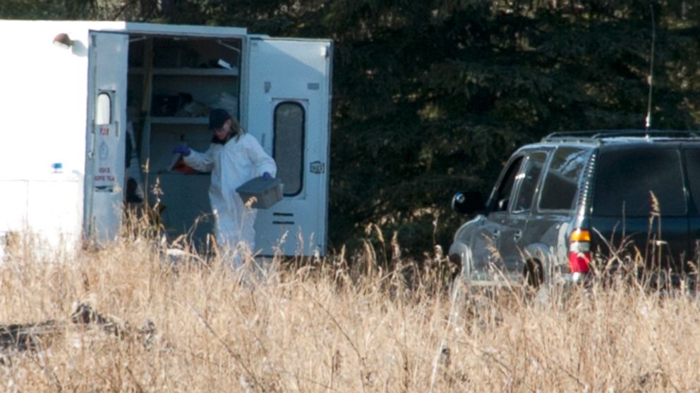 PHOTO: Investigators set up a temporary facility between Alpine Drive and Borgen Avenue, March 22, 2015, after finding human remains that could be a family from Kenai, Alaska.