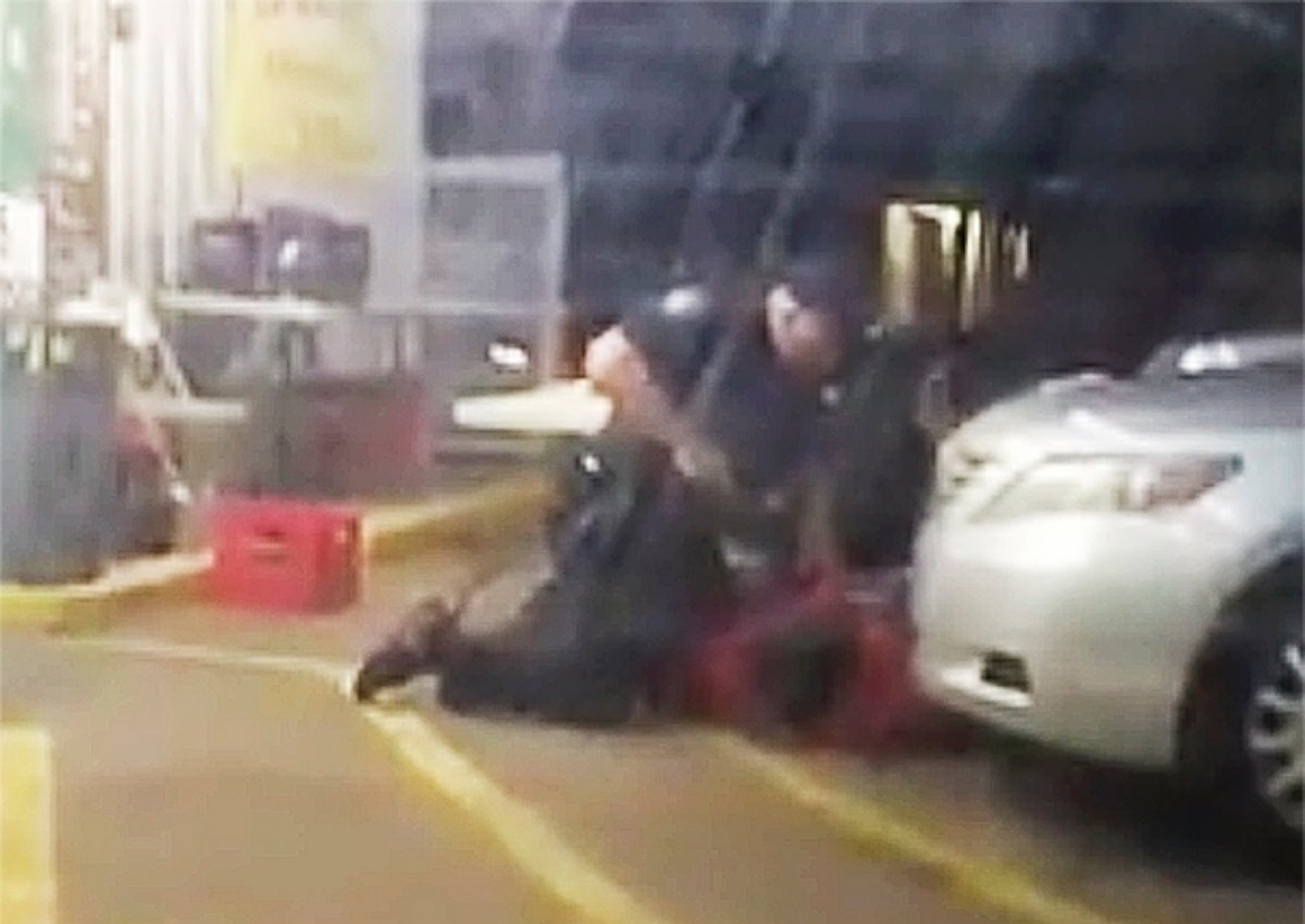 PHOTO: In this photo made from video, Alton Sterling is held by two Baton Rouge police officers outside a convenience store in Baton Rouge, Louisiana, July 5, 2016, moments before Sterling was fatally shot.