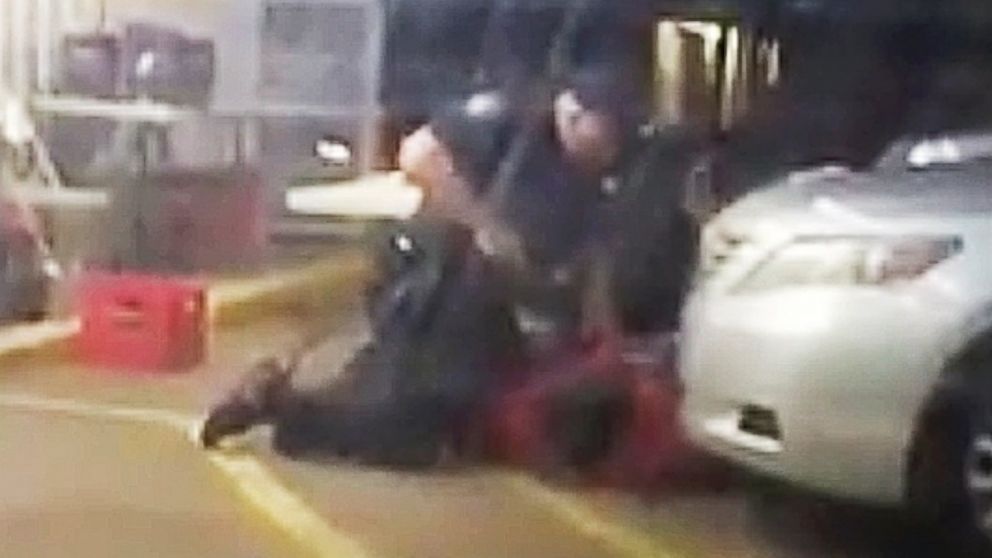 In this photo made from video, Alton Sterling is held by two Baton Rouge police officers outside a convenience store in Baton Rouge, Louisiana, July 5, 2016, moments before Sterling was fatally shot.