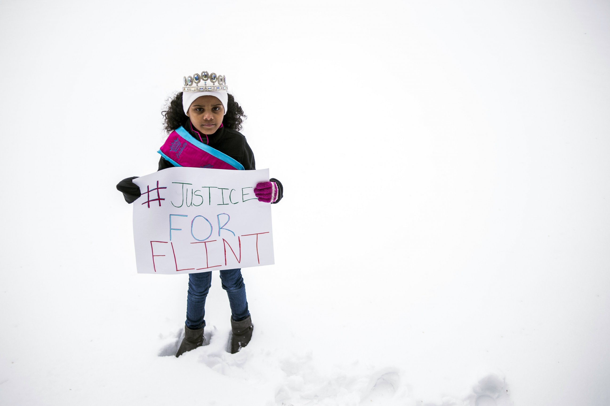 PHOTO: In a March 6, 2016 photo, Mari Copeny, 8, of Flint, Mich., stands with a protest sign during a #Justice4Flint rally at Wilson Park on University of Michigan-Flint's campus in Flint, Mich.