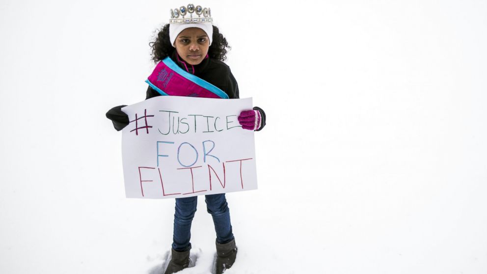 PHOTO: In a March 6, 2016 photo, Mari Copeny, 8, of Flint, Mich., stands with a protest sign during a #Justice4Flint rally at Wilson Park on University of Michigan-Flint's campus in Flint, Mich.