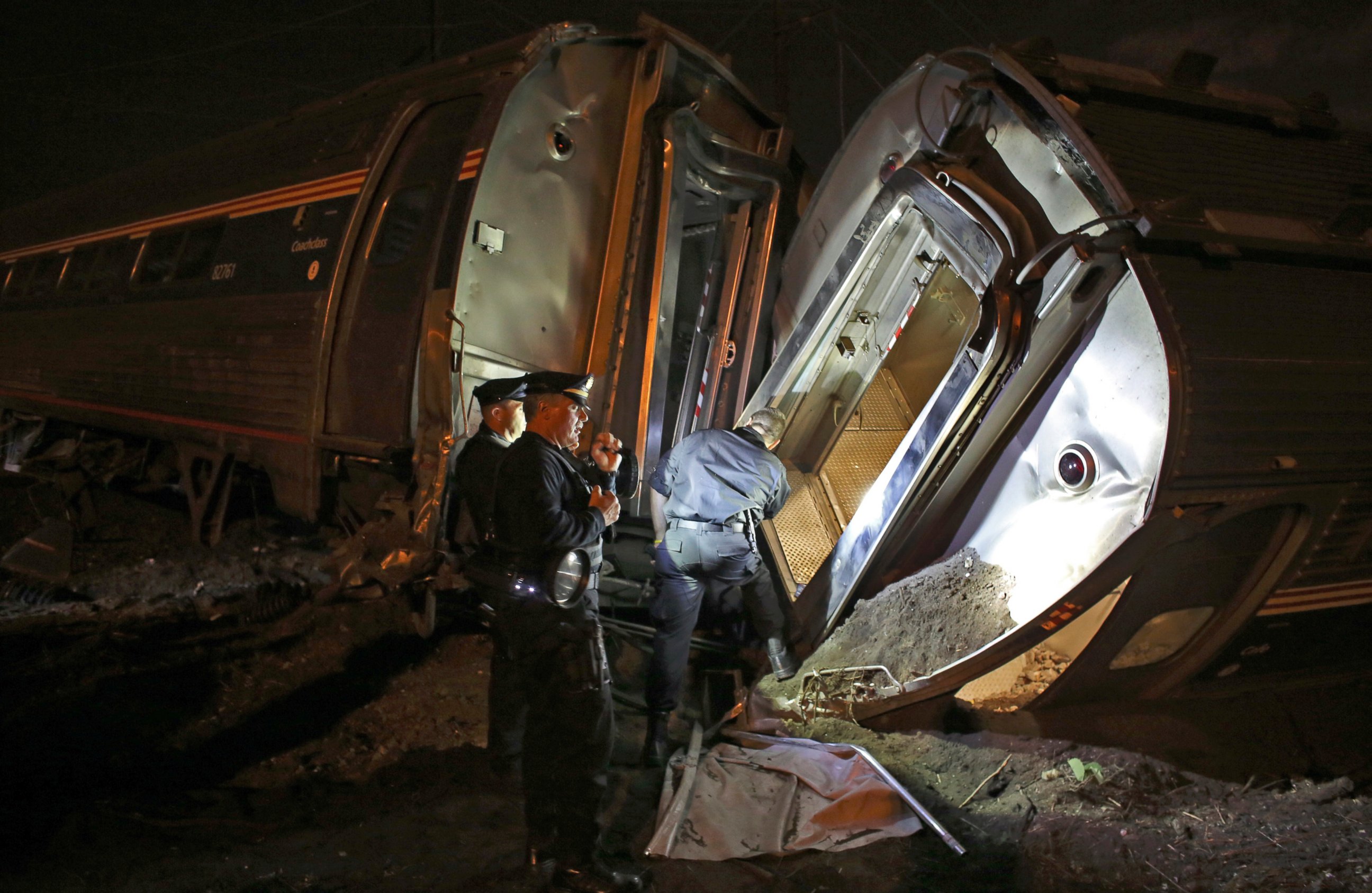 PHOTO: Emergency personnel work the scene of a train wreck, May 12, 2015, near Philadelphia.