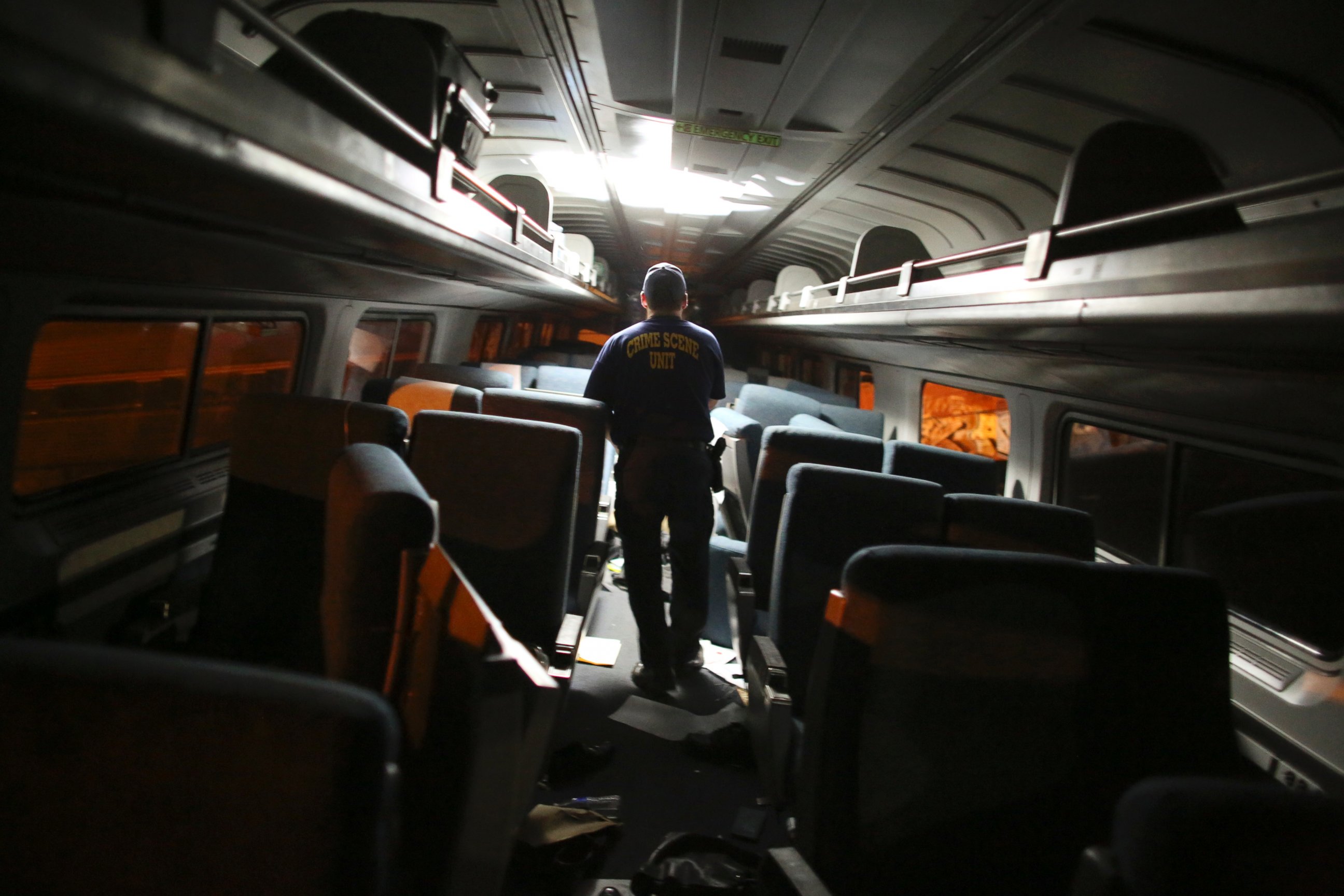 PHOTO: A crime scene investigator looks inside a train car after a train wreck, Tuesday, May 12, 2015, near Philadelphia.