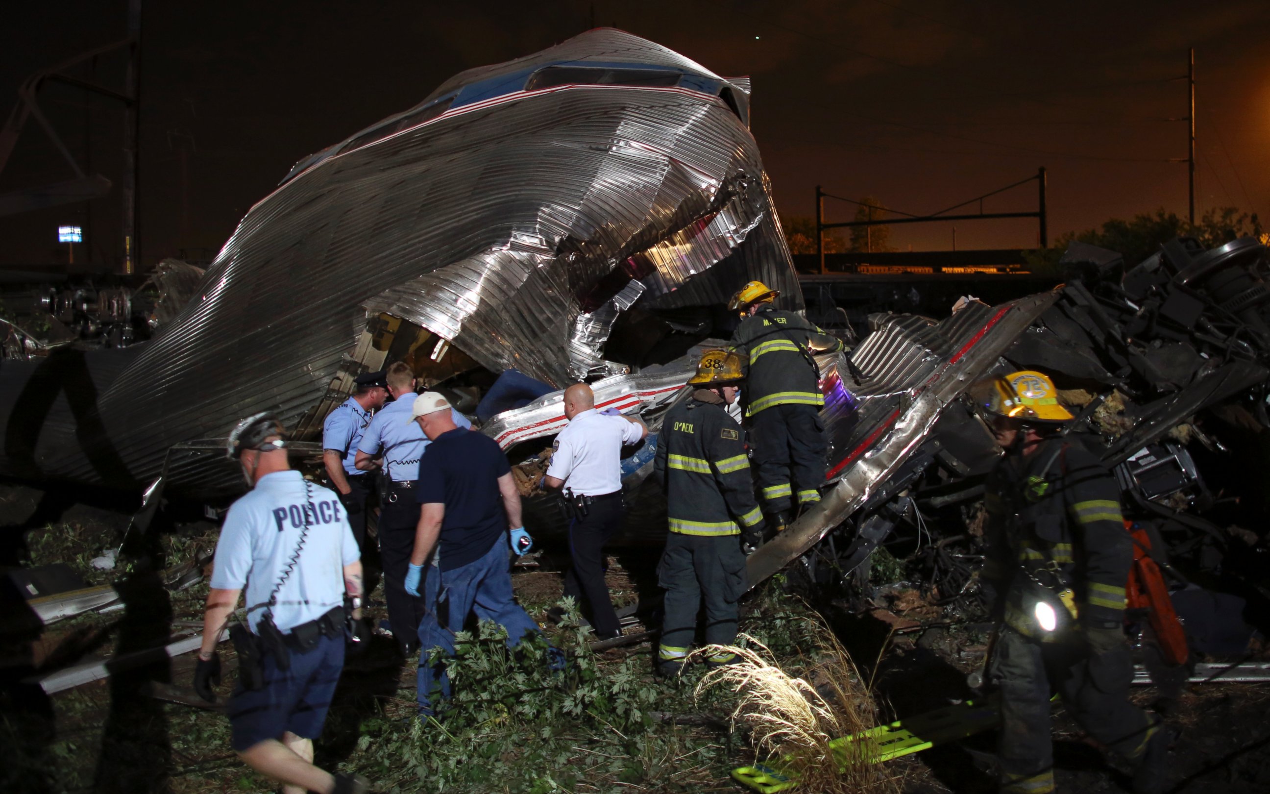 PHOTO: Emergency personnel work the scene of a train wreck, May 12, 2015, outside Philadelphia.