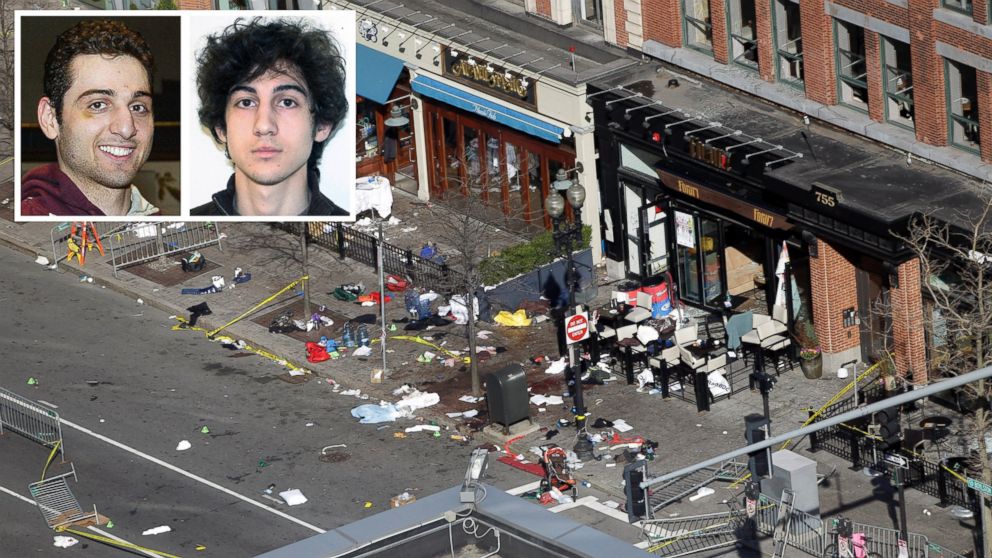 The scene of one of the blast sites near the finish line of the Boston Marathon is seen in this April 16, 2013 file photo, taken one day after bomb blasts killed three and injured over 140 people. Inset, suspects Tamerlan and Dzhokhar Tsarnaev are seen.