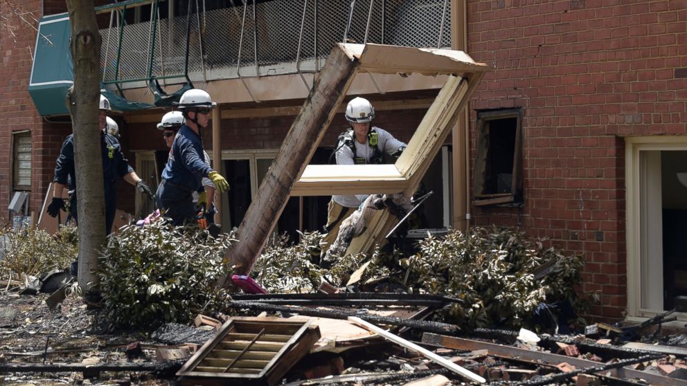 PHOTO: Emergency personnel clear out a basement room of an apartment building following a fire in Silver Spring, Maryland, Aug. 11, 2016.