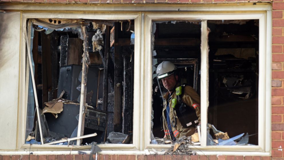 PHOTO: Emergency personnel investigate the inside of an apartment building following a fire in Silver Spring, Maryland, Aug. 11, 2016.