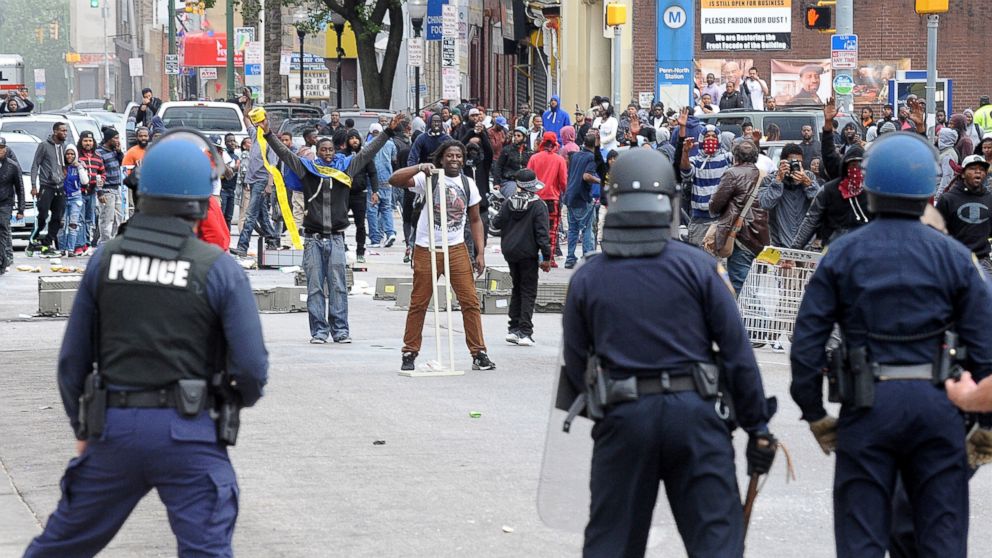 PHOTO: Protesters face police following the funeral of Freddie Gray, April 27, 2015, in Baltimore. 