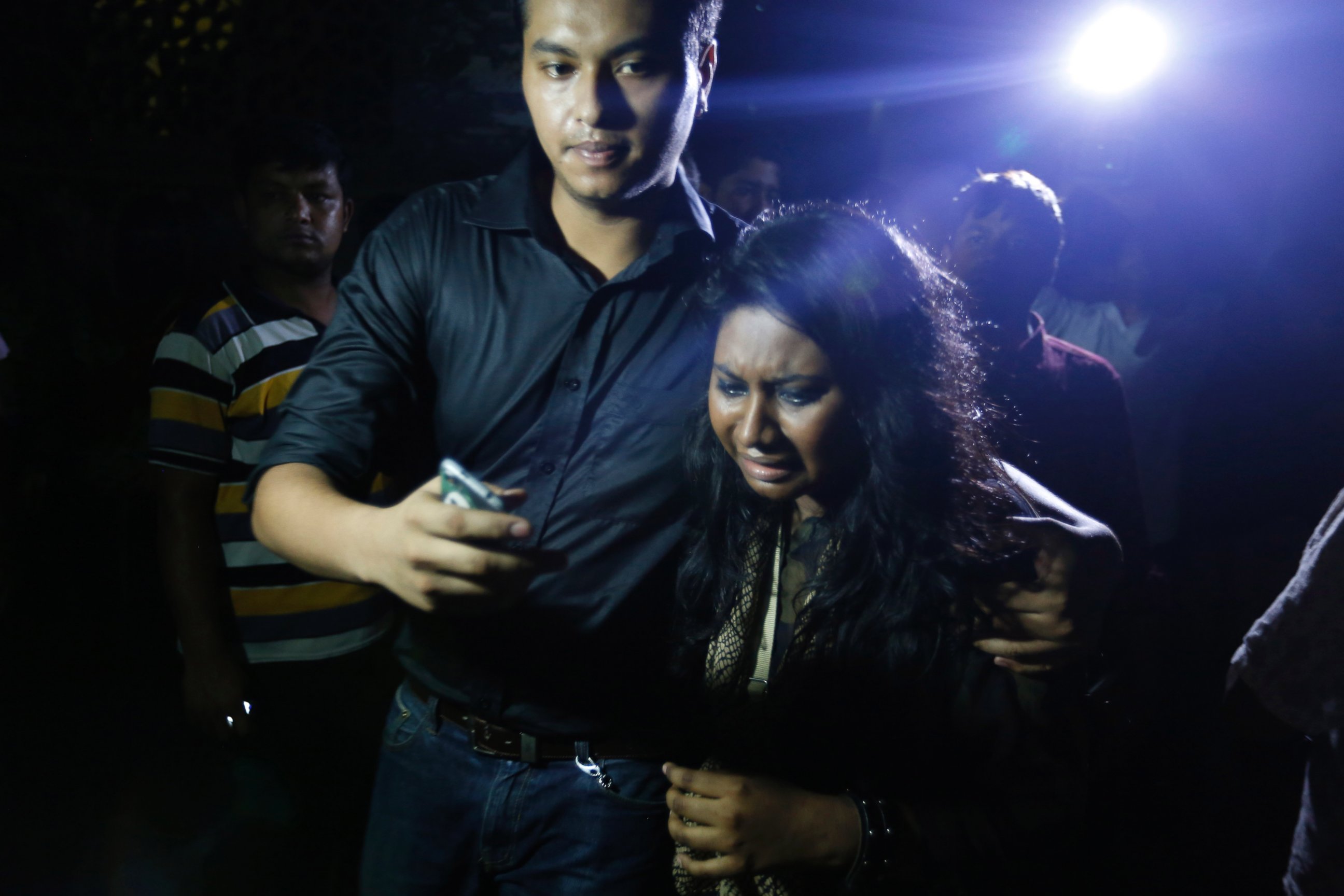 PHOTO: An unidentified coworker of U.S. Agency for International Development employee Xulhaz Mannan, who was stabbed to death, reacts as she returns from the crime scene in Dhaka, Bangladesh, April 25, 2016.