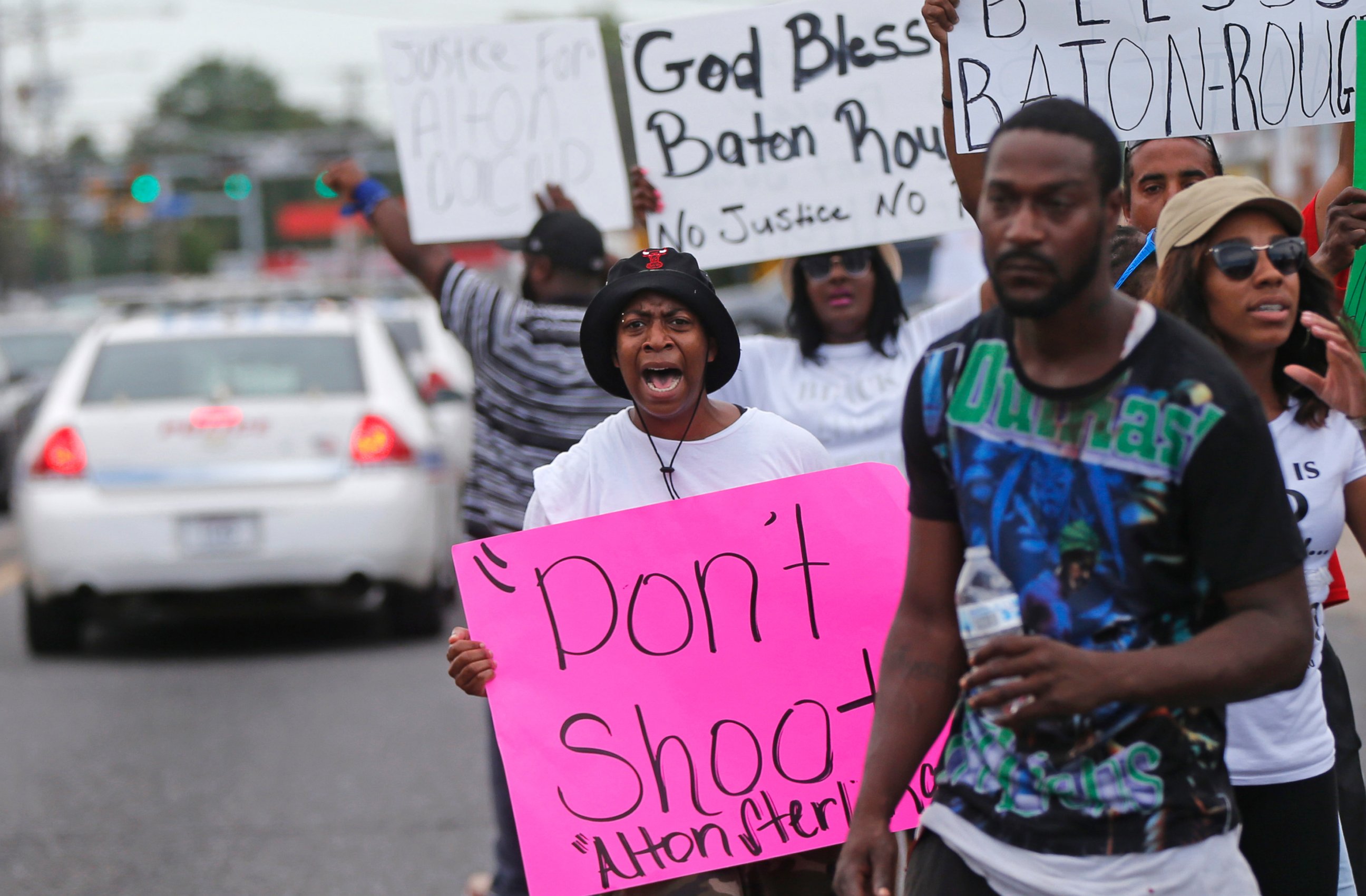 PHOTO: People demonstrate in the street as police cars pass outside the Triple S convenience store in Baton Rouge, La., Wednesday, July 6, 2016. Alton Sterling, 37, was shot and killed outside the store by Baton Rouge police, where he was selling CDs.