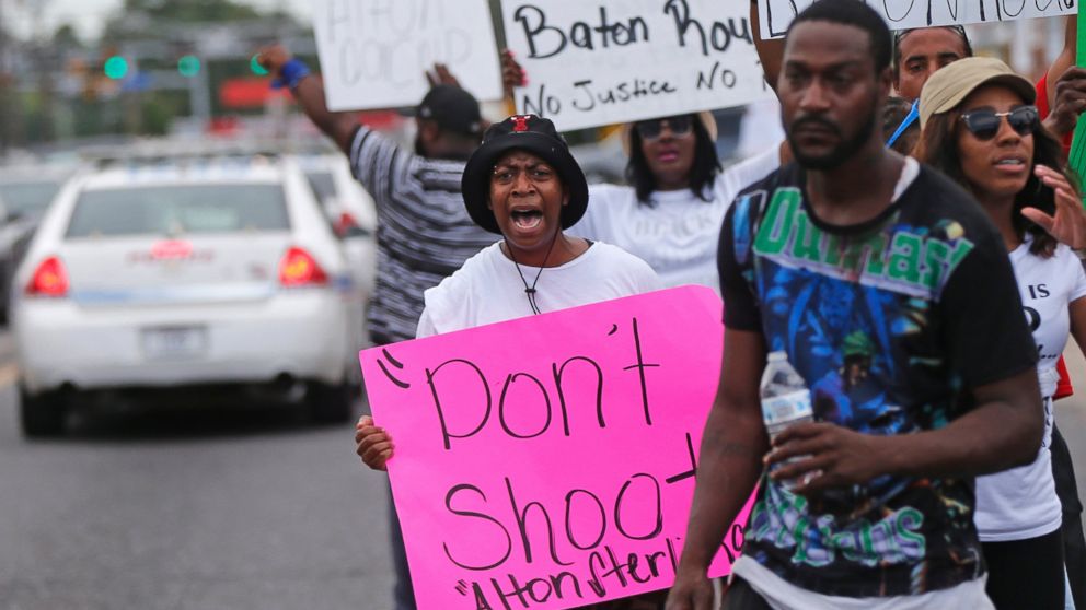 PHOTO: People demonstrate in the street as police cars pass outside the Triple S convenience store in Baton Rouge, La., Wednesday, July 6, 2016. Alton Sterling, 37, was shot and killed outside the store by Baton Rouge police, where he was selling CDs.