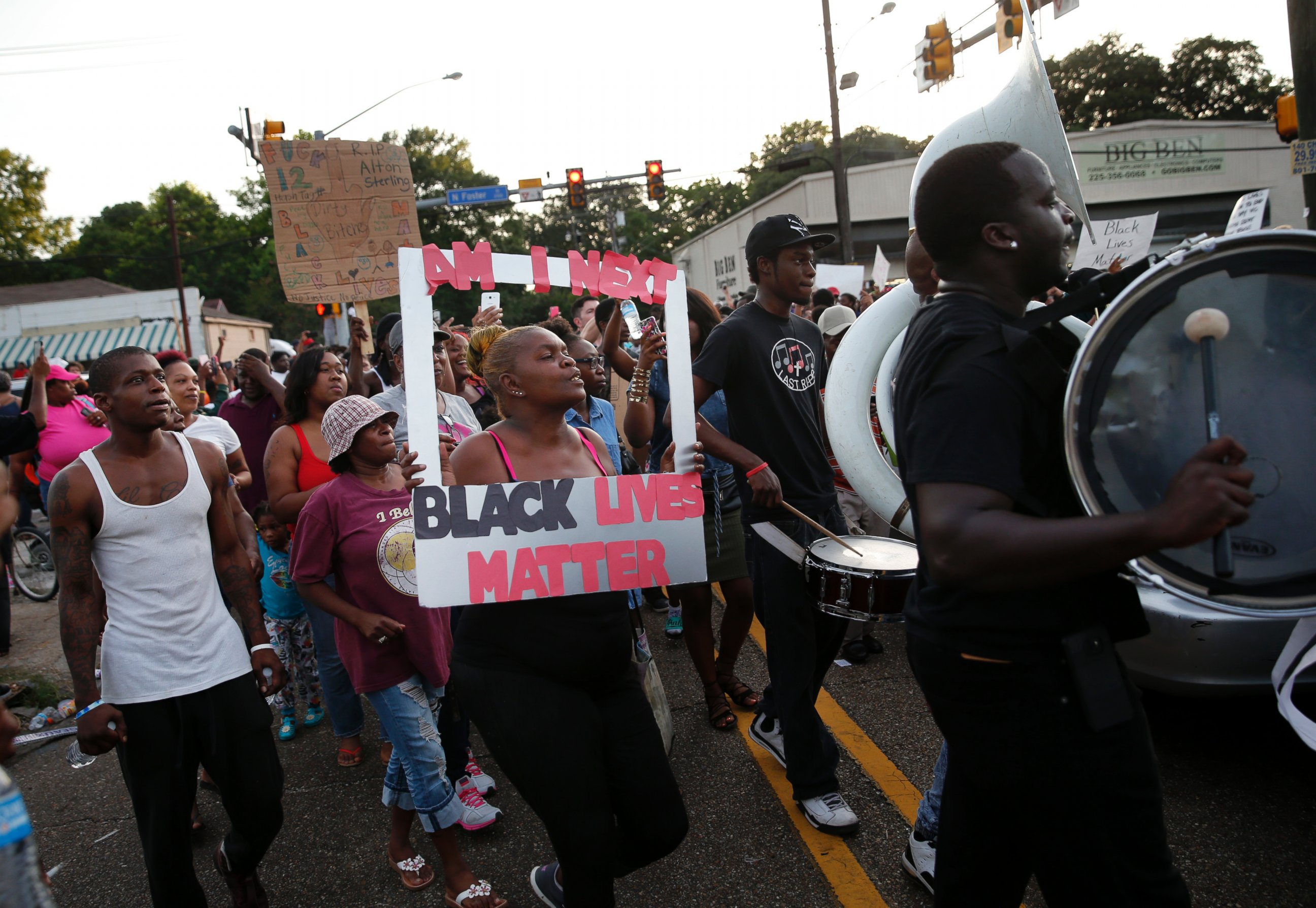 PHOTO: People follow a brass band through the street after a vigil for Alton Sterling, who was shot and killed during a scuffle with police officers, outside the Triple S convenience store in Baton Rouge, La., Wednesday, July 6, 2016. 