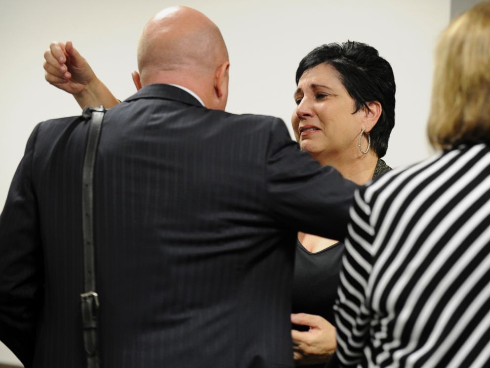 PHOTO: Rosalie Bolin, the wife of Oscar Ray Bolin Jr. hugs defense attorney Bjorn Brunvand after Oscar Ray Bolin Jr. was found guilty in the killing of Natalie Blanche Holley, April 19, 2012 in Tampa.