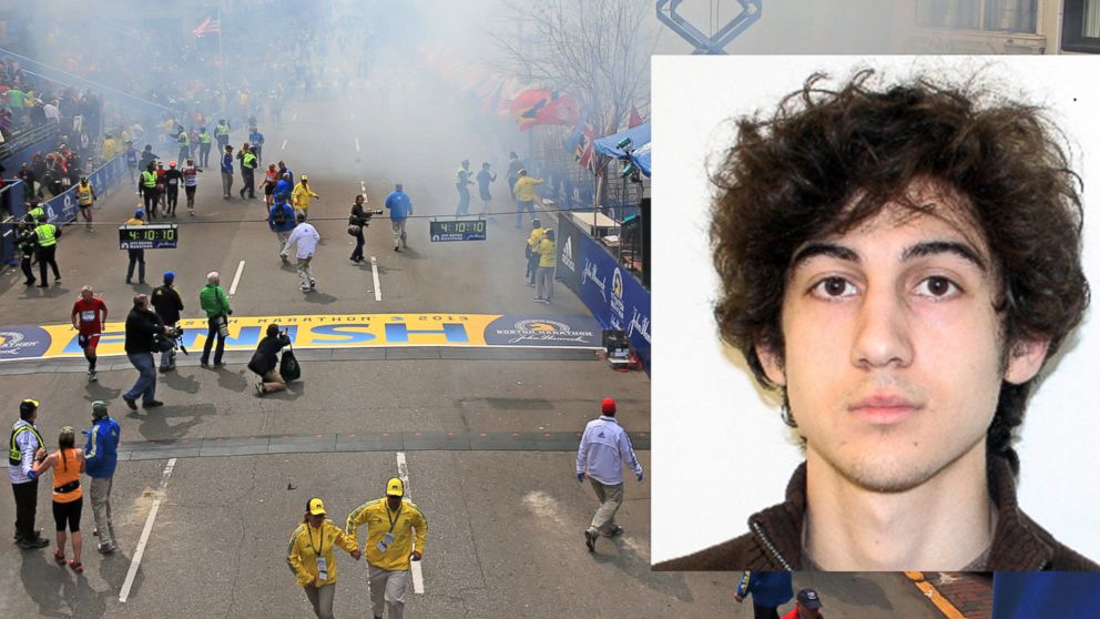 Smoke rises after two explosions went off near the finish line of the 117th Boston Marathon, April 15, 2013. FBI released an image of suspect Dzhokhar Tsarnaev before he was apprehended. 