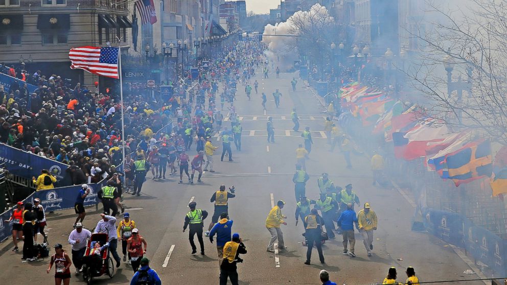 PHOTO: People react as an explosion goes off near the finish line of the 2013 Boston Marathon in Boston on April 15, 2013.